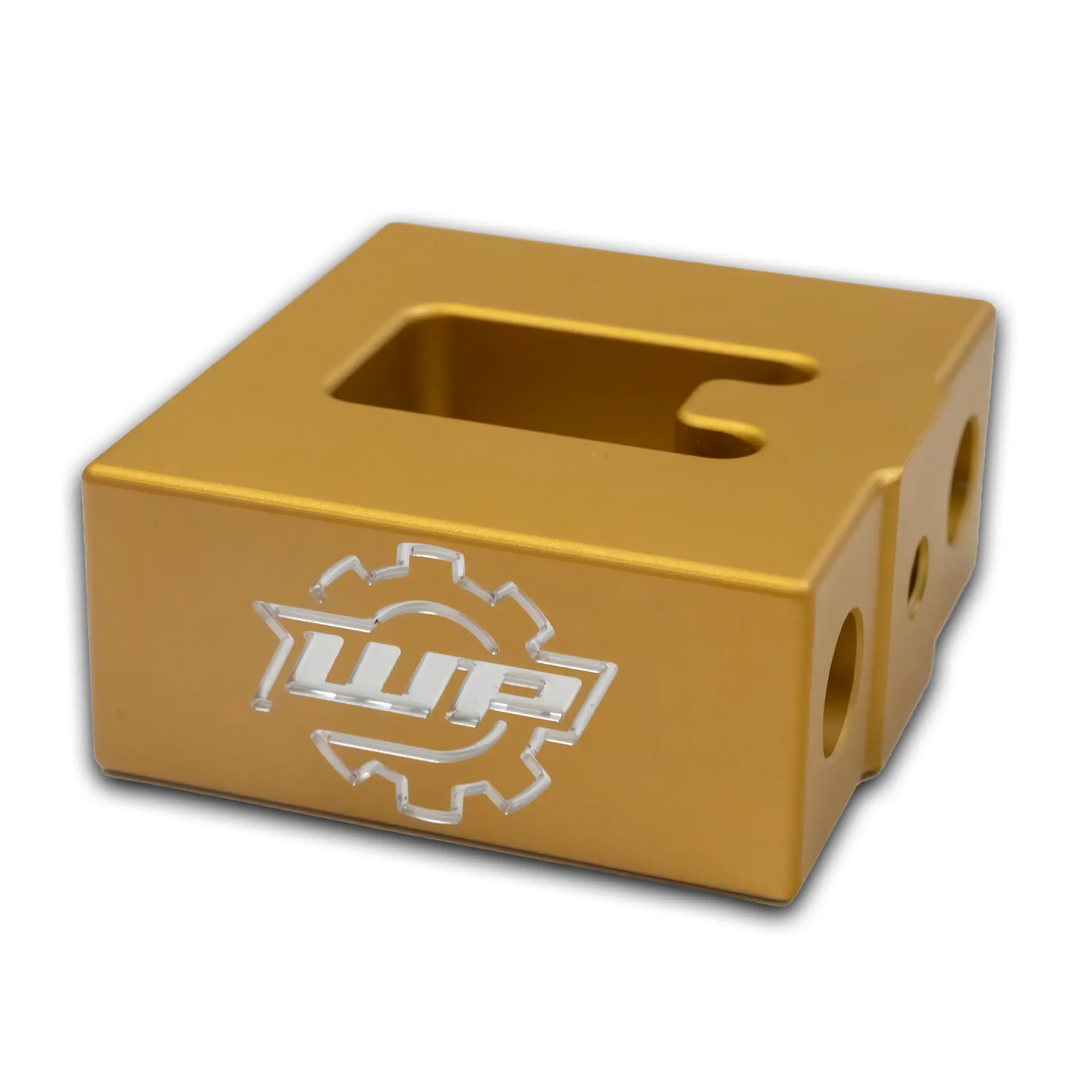 gold rectangular block with rounded edges and a square recessed opening on the top surface, viewed at an angle.